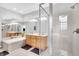 Elegant bathroom with double sinks, a soaking tub, and a walk-in shower at 141 S Meridian St # 605, Indianapolis, IN 46225