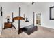 Spacious bedroom with a post bed, carpet flooring, and ensuite bathroom access at 141 S Meridian St # 605, Indianapolis, IN 46225