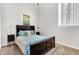 Simple bedroom with double bed, carpet flooring and window at 141 S Meridian St # 605, Indianapolis, IN 46225