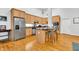 Modern kitchen with light wood cabinets, granite countertops, and stainless steel appliances at 141 S Meridian St # 605, Indianapolis, IN 46225