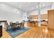 Modern kitchen with light wood cabinets, granite countertops, and stainless steel appliances at 141 S Meridian St # 605, Indianapolis, IN 46225