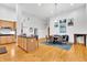 Open concept kitchen with light wood cabinets, island, and dining area at 141 S Meridian St # 605, Indianapolis, IN 46225