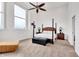 Large main bedroom with high ceilings, carpeted floors, and a post bed at 141 S Meridian St # 605, Indianapolis, IN 46225