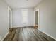 Spacious bedroom with neutral walls and wood-look vinyl flooring at 1819 Southeastern Ave, Indianapolis, IN 46201