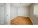 Small bedroom with neutral walls, wood-look flooring, and closet at 1819 Southeastern Ave, Indianapolis, IN 46201