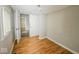 Simple bedroom with neutral walls and wood-look flooring at 1819 Southeastern Ave, Indianapolis, IN 46201