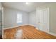 Simple bedroom with neutral walls and wood-look flooring at 1819 Southeastern Ave, Indianapolis, IN 46201