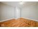 Simple bedroom with neutral walls and wood-look flooring at 1819 Southeastern Ave, Indianapolis, IN 46201
