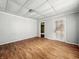 Empty bedroom displaying wood floors, light colored walls, and a single light fixture on the ceiling at 1819 Southeastern Ave, Indianapolis, IN 46201