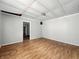 Bedroom featuring wood floors and a view through a doorway into another area of the house at 1819 Southeastern Ave, Indianapolis, IN 46201