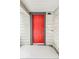 Bright red front door entrance with gray trim at 1819 Southeastern Ave, Indianapolis, IN 46201