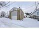 Detached garage with overhead door, winter view at 1819 Southeastern Ave, Indianapolis, IN 46201