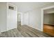 Hallway with wood-look vinyl flooring and access to bedrooms at 1819 Southeastern Ave, Indianapolis, IN 46201
