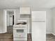 Kitchen with stove, refrigerator, and an adjacent room, creating an open layout at 1819 Southeastern Ave, Indianapolis, IN 46201