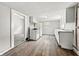 Kitchen area with vinyl flooring, white cabinets, and essential appliances at 1819 Southeastern Ave, Indianapolis, IN 46201