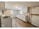 Simple kitchen with white cabinets and vinyl flooring at 1819 Southeastern Ave, Indianapolis, IN 46201