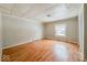Simple living room with light walls and wood floors at 1819 Southeastern Ave, Indianapolis, IN 46201