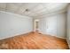 Simple living room with light walls and wood floors at 1819 Southeastern Ave, Indianapolis, IN 46201