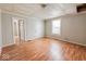 Simple living room with light walls and wood floors at 1819 Southeastern Ave, Indianapolis, IN 46201