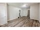 Open living area showcasing wood-look floors and multiple entryways at 1819 Southeastern Ave, Indianapolis, IN 46201