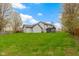 A large backyard features a spacious lawn and a home with a screened-in porch at 20485 Country Pine Ct, Noblesville, IN 46062