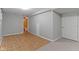 Partially finished basement showcasing tile flooring alongside carpeted area and access to a bathroom at 20485 Country Pine Ct, Noblesville, IN 46062