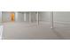 Spacious basement with gray carpet, white columns, and access to a bathroom at 20485 Country Pine Ct, Noblesville, IN 46062