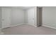 Comfortable bedroom with neutral carpet, gray walls, and two white doors at 20485 Country Pine Ct, Noblesville, IN 46062