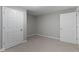 Cozy bedroom features neutral carpet, gray walls, and convenient access to two closet doors at 20485 Country Pine Ct, Noblesville, IN 46062