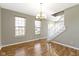 Well-lit dining room, hardwood floors, and staircase at 20485 Country Pine Ct, Noblesville, IN 46062