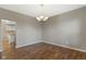 Bright dining room features hardwood floors and a chandelier at 20485 Country Pine Ct, Noblesville, IN 46062