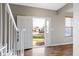 Bright entryway with hardwood floors and open staircase at 20485 Country Pine Ct, Noblesville, IN 46062