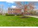 Charming two-story brick home with blue shutters and a three-car garage at 20485 Country Pine Ct, Noblesville, IN 46062