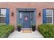 Charming brick home featuring a welcoming front door, blue shutters and planters at 20485 Country Pine Ct, Noblesville, IN 46062