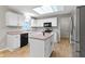 Bright kitchen featuring white cabinets, an island, and stainless steel appliances at 20485 Country Pine Ct, Noblesville, IN 46062