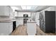 Bright kitchen featuring white cabinets, an island, and stainless steel appliances at 20485 Country Pine Ct, Noblesville, IN 46062
