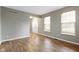 Living room featuring wood floors and lots of natural light from the windows at 20485 Country Pine Ct, Noblesville, IN 46062