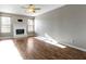 Living room with hardwood floors, fireplace and ceiling fan at 20485 Country Pine Ct, Noblesville, IN 46062