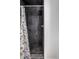 Shower with dark gray slate tile and floral curtain at 220 N Beville Ave, Indianapolis, IN 46201