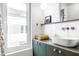 Main bathroom with a modern vanity, white subway tile, and patterned shower curtain at 220 N Beville Ave, Indianapolis, IN 46201