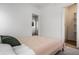 Bright bedroom with a comfortable bed and access to a walk-in closet at 220 N Beville Ave, Indianapolis, IN 46201