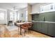 Open concept kitchen and living area with modern cabinetry and cork flooring at 220 N Beville Ave, Indianapolis, IN 46201