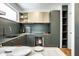 Contemporary kitchen with green cabinets and built-in oven at 220 N Beville Ave, Indianapolis, IN 46201
