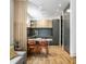 Contemporary kitchen with gray cabinets and cork flooring at 220 N Beville Ave, Indianapolis, IN 46201