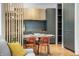 Modern kitchen with gray cabinets and a dining area at 220 N Beville Ave, Indianapolis, IN 46201