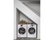 Basement laundry area with stackable washer and dryer at 220 N Beville Ave, Indianapolis, IN 46201