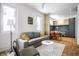 Bright living room with gray sofa, coffee table, and ample natural light at 220 N Beville Ave, Indianapolis, IN 46201