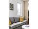 Comfortable living room with gray sofa and yellow pillows at 220 N Beville Ave, Indianapolis, IN 46201