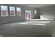 Spacious living room with large windows and sliding glass doors at 241 Ames Dr, Whiteland, IN 46184