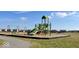 Modern playground with swings, climbing structure, and slide at 241 Ames Dr, Whiteland, IN 46184